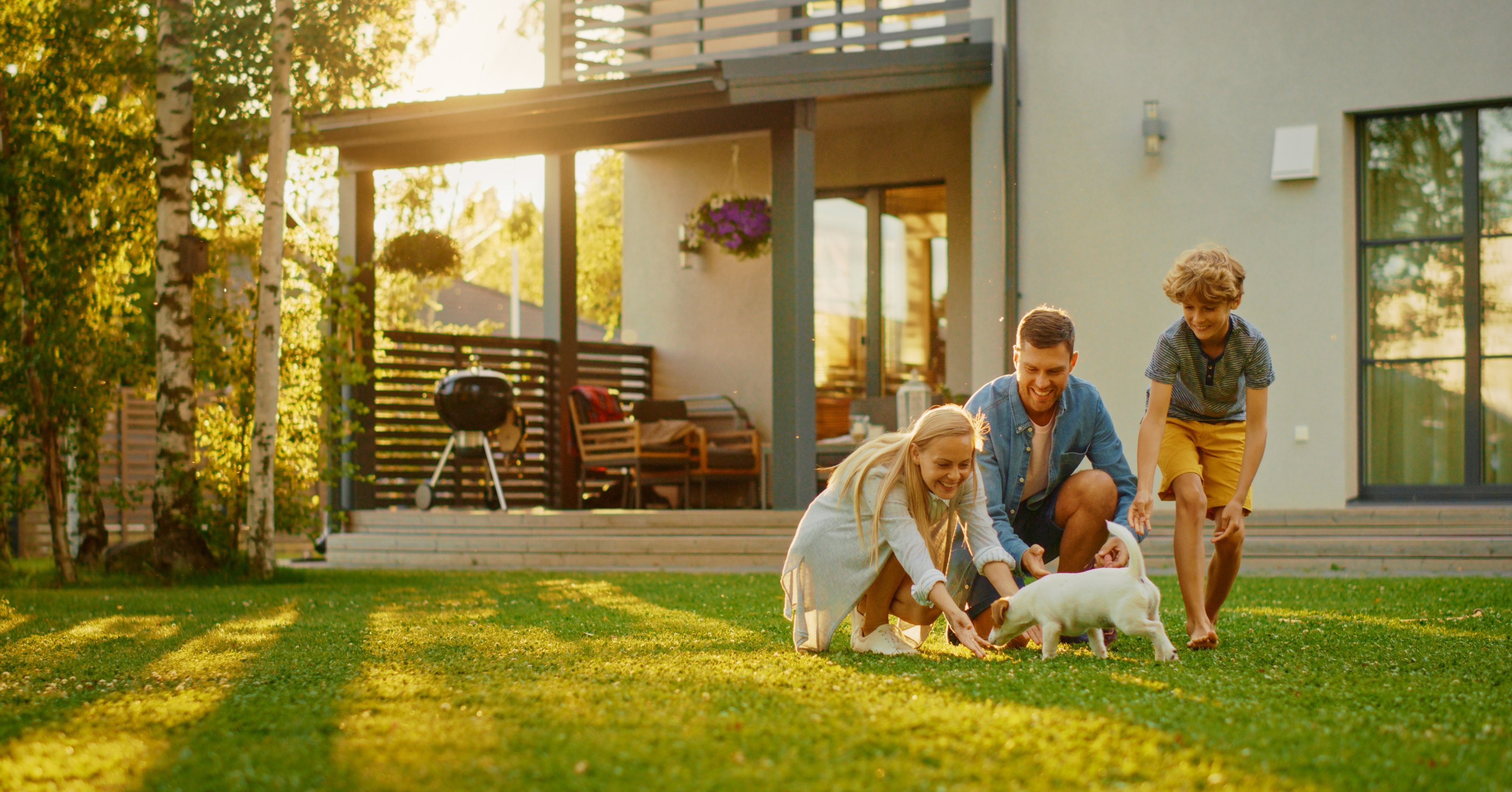 Family Playing Outside House
