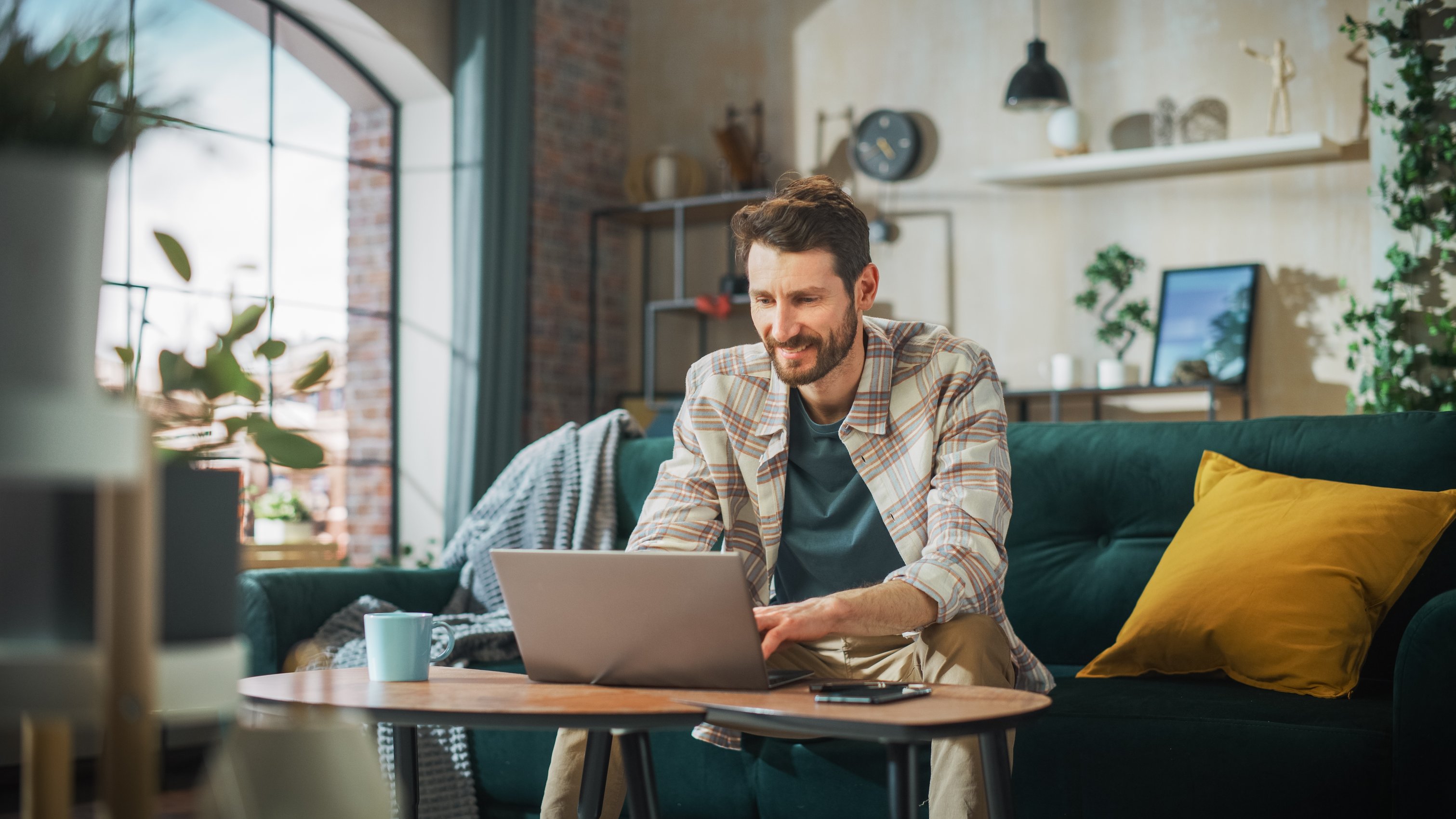 Man on Couch on Computer