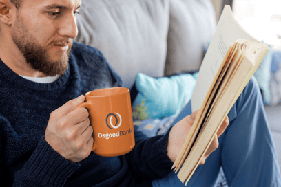 mug-mockup-of-a-bearded-man-drinking-coffee-and-reading-a-book-24022